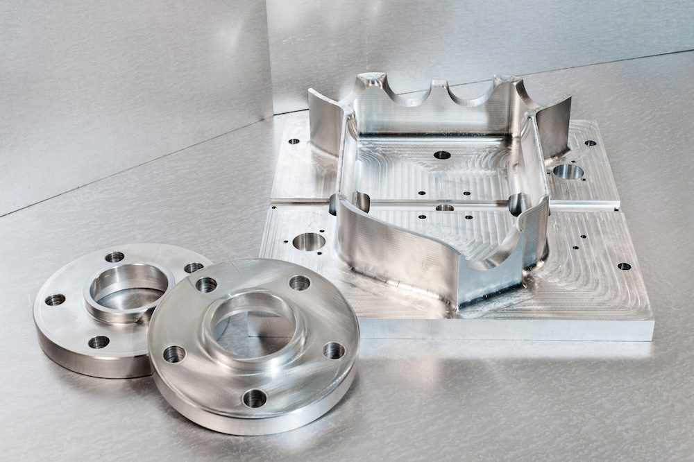 6061 aluminum stock and 304 stainless steel machined to print.